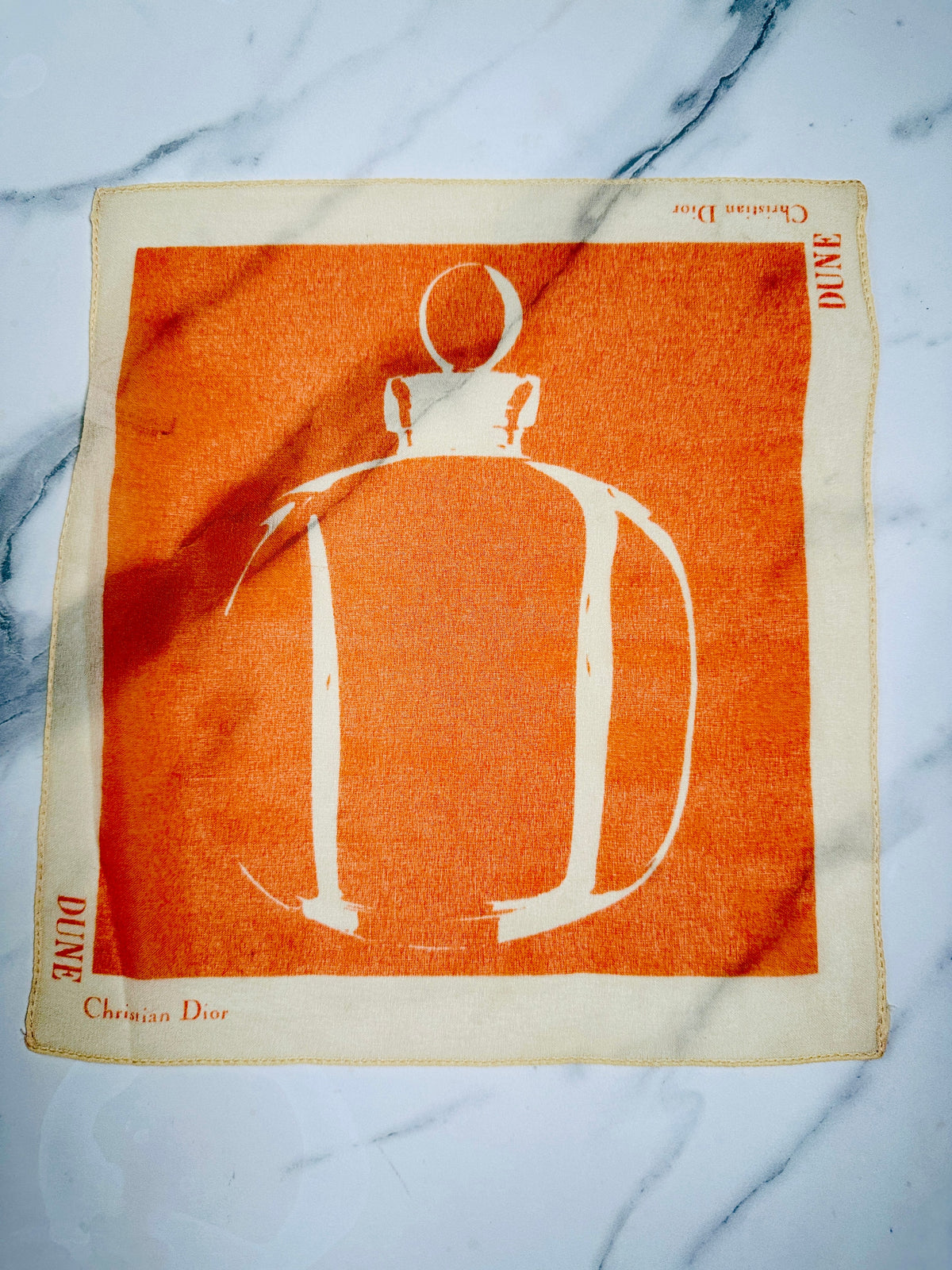 Petit carré Christian Dior orange et ivoire motif flacon Dune vintage authentique