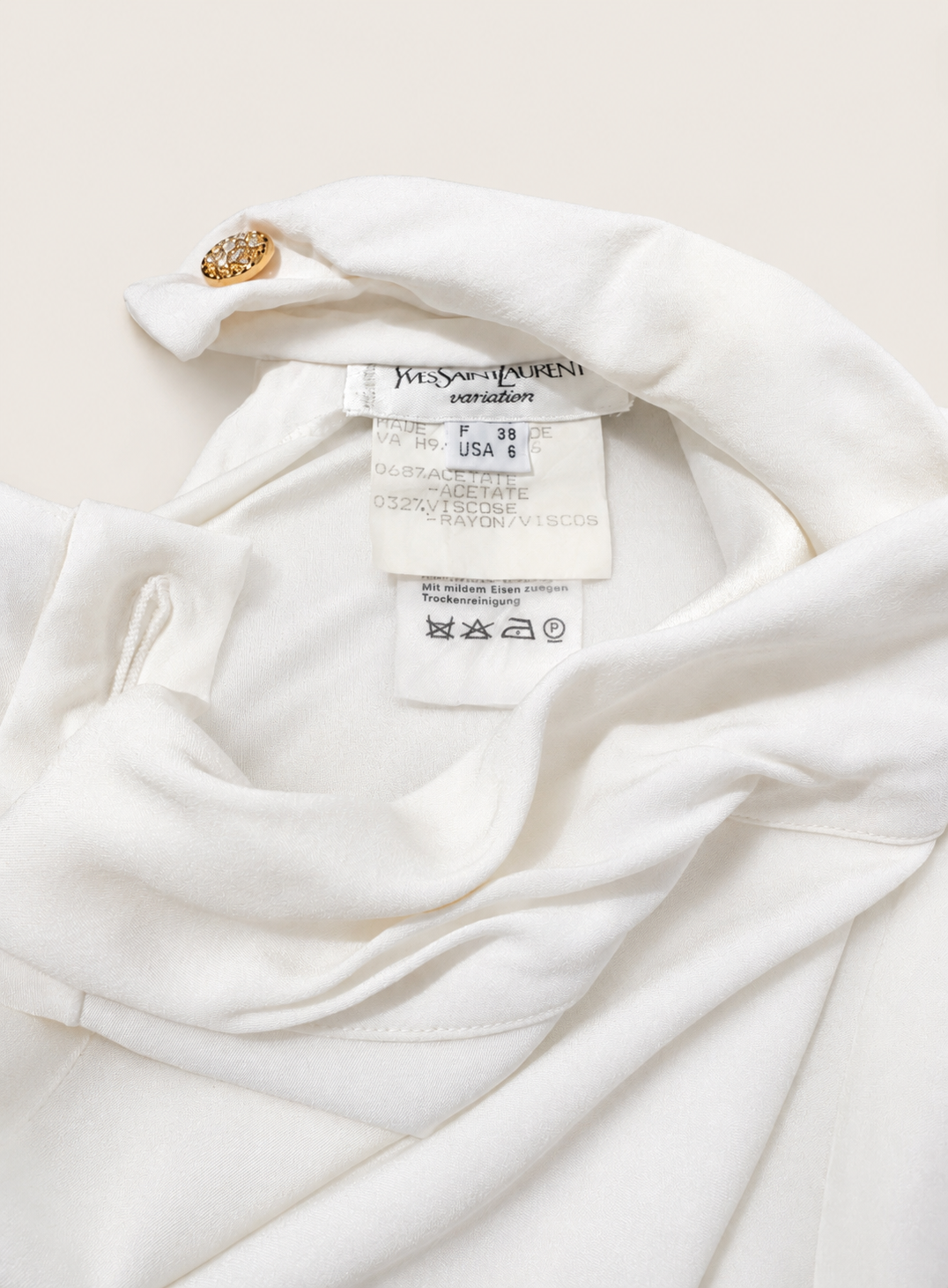 Authentic white top Yves Saint Laurent Variation with high collar.