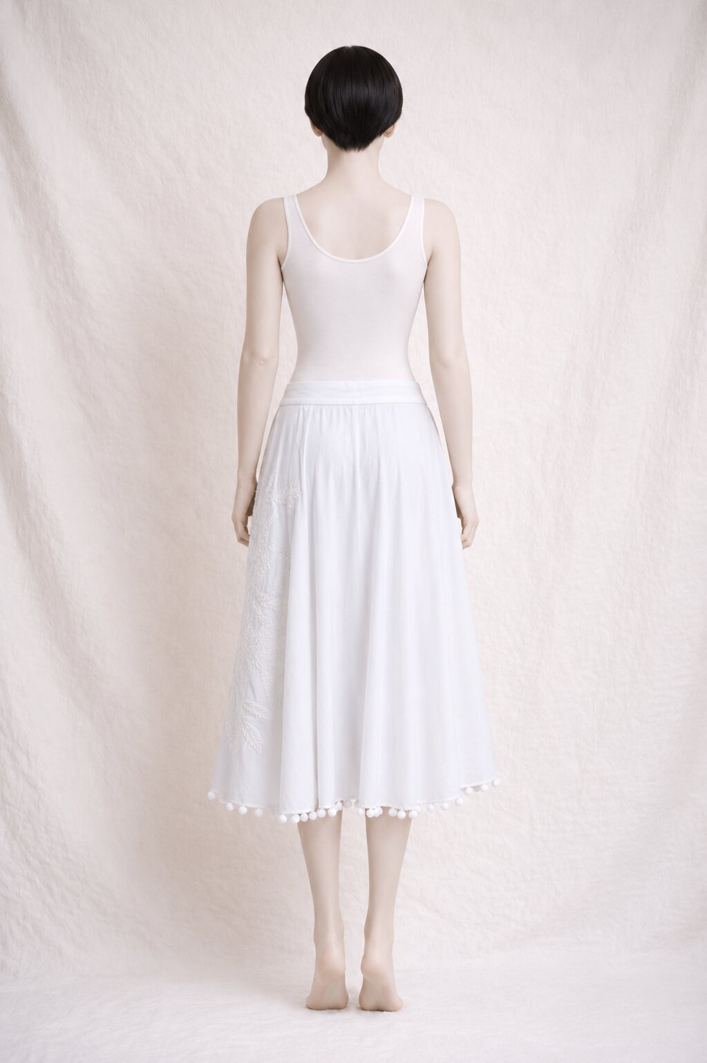 White embroidered midi skirt Tara Jarmon in cotton with pom poms