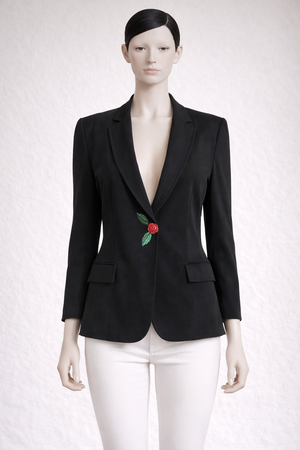 Blazer noir Moschino avec bouton rose