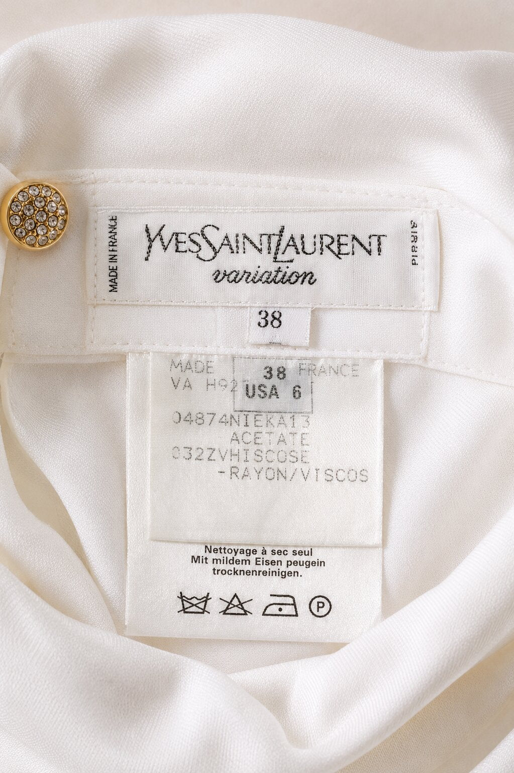Authentic white top Yves Saint Laurent Variation with high collar.