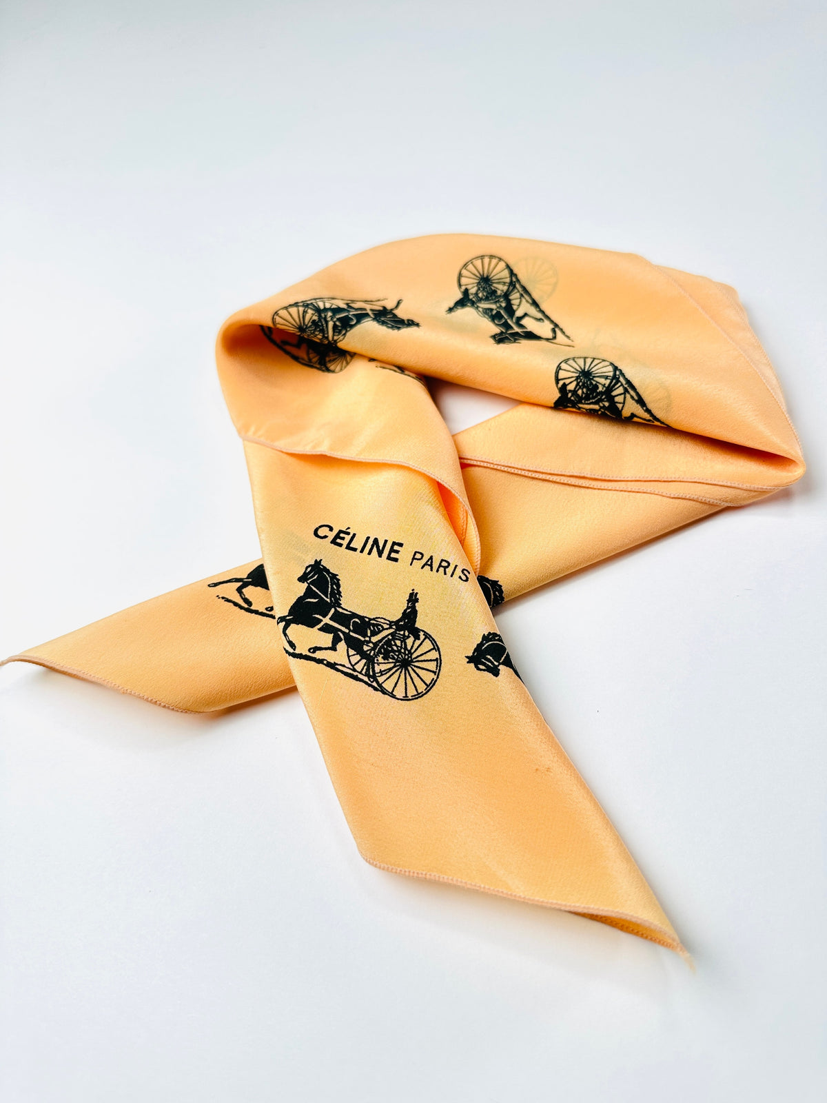 Silk scarf Céline in apricot and black vintage equestrian pattern