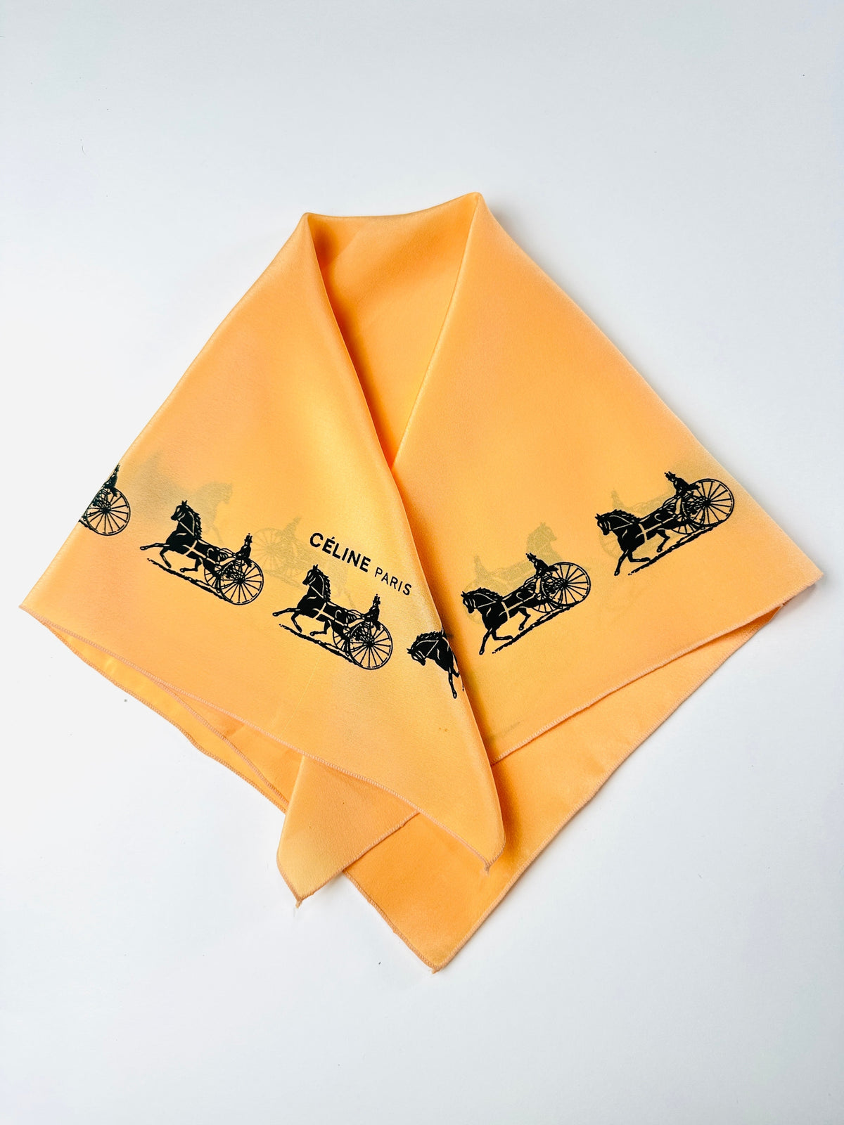 Silk scarf Céline in apricot and black vintage equestrian pattern