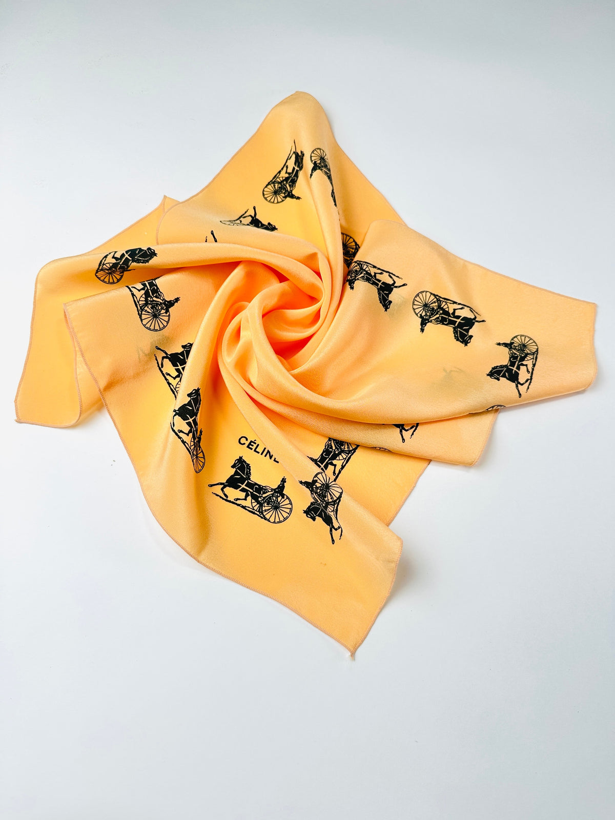 Silk scarf Céline in apricot and black vintage equestrian pattern