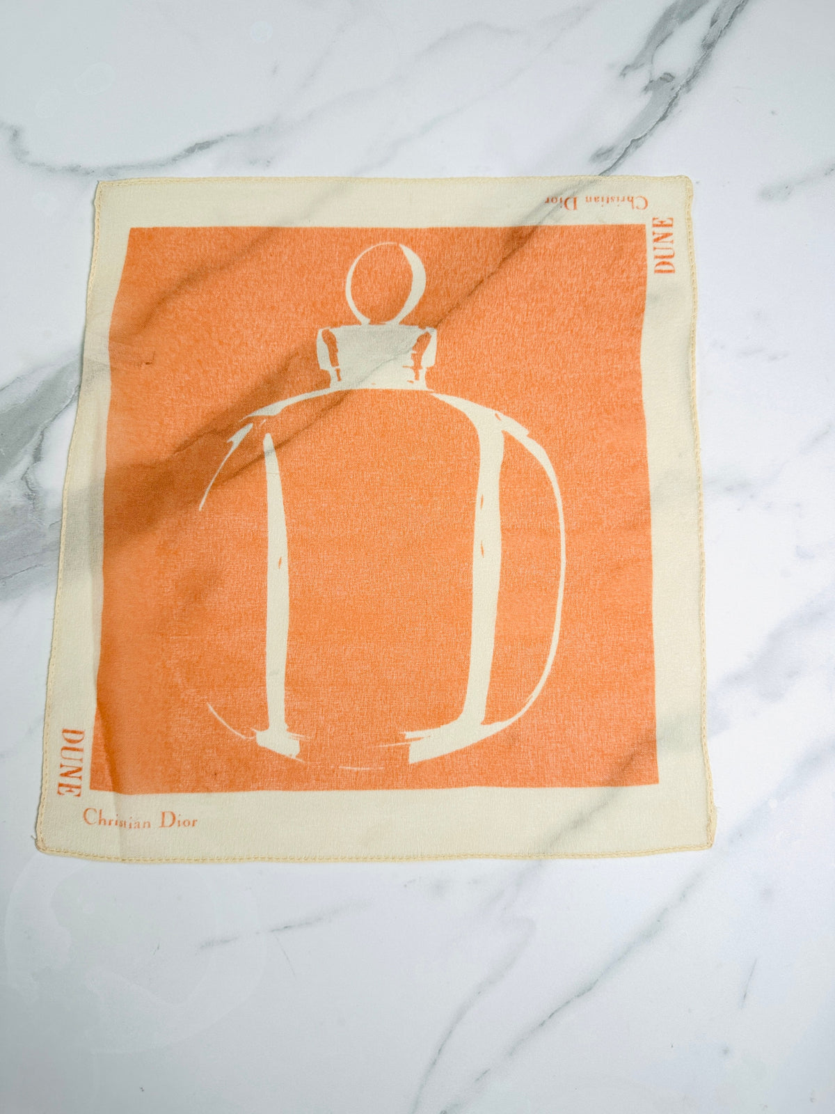 Petit carré Christian Dior orange et ivoire motif flacon Dune vintage authentique
